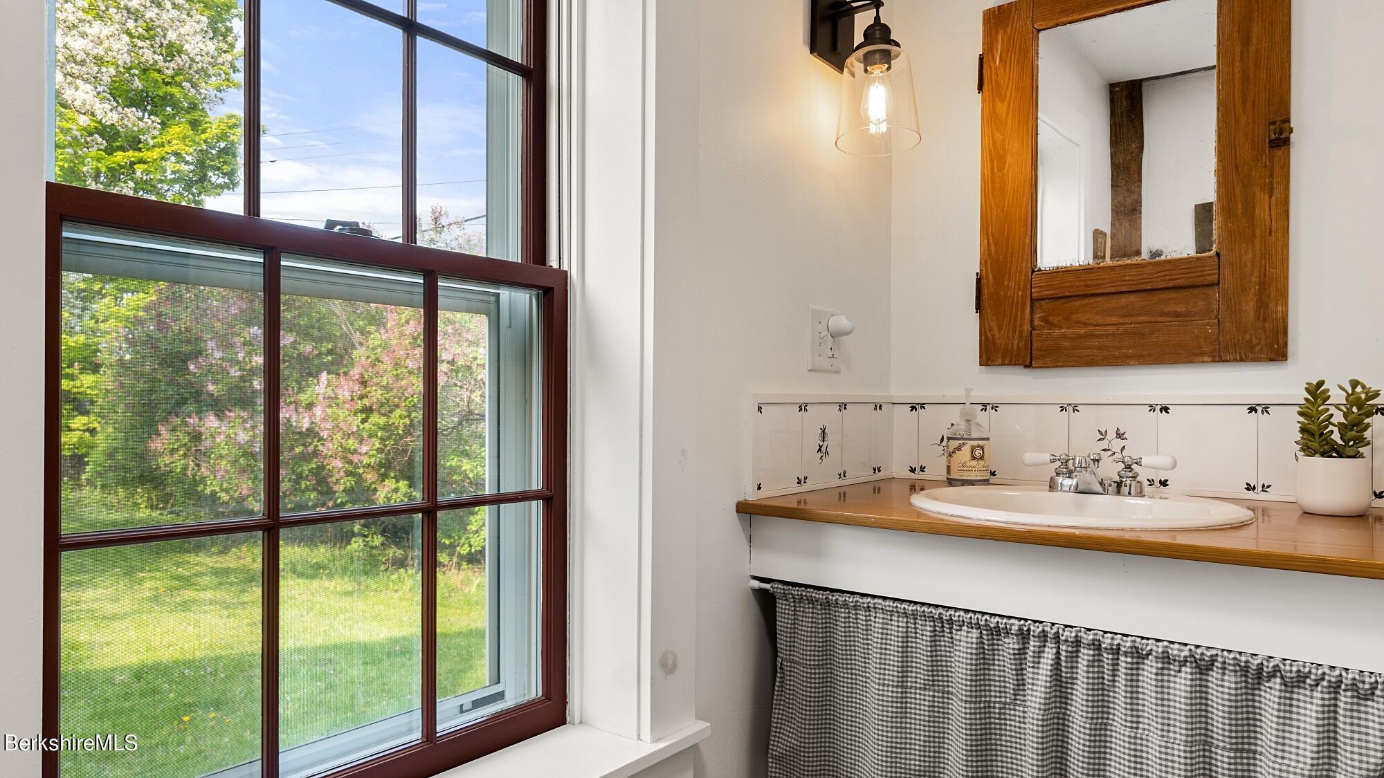 2325 Hancock Road Hancock, MA 01267 - Photo 46 of 61 a bathroom with a sink and a window