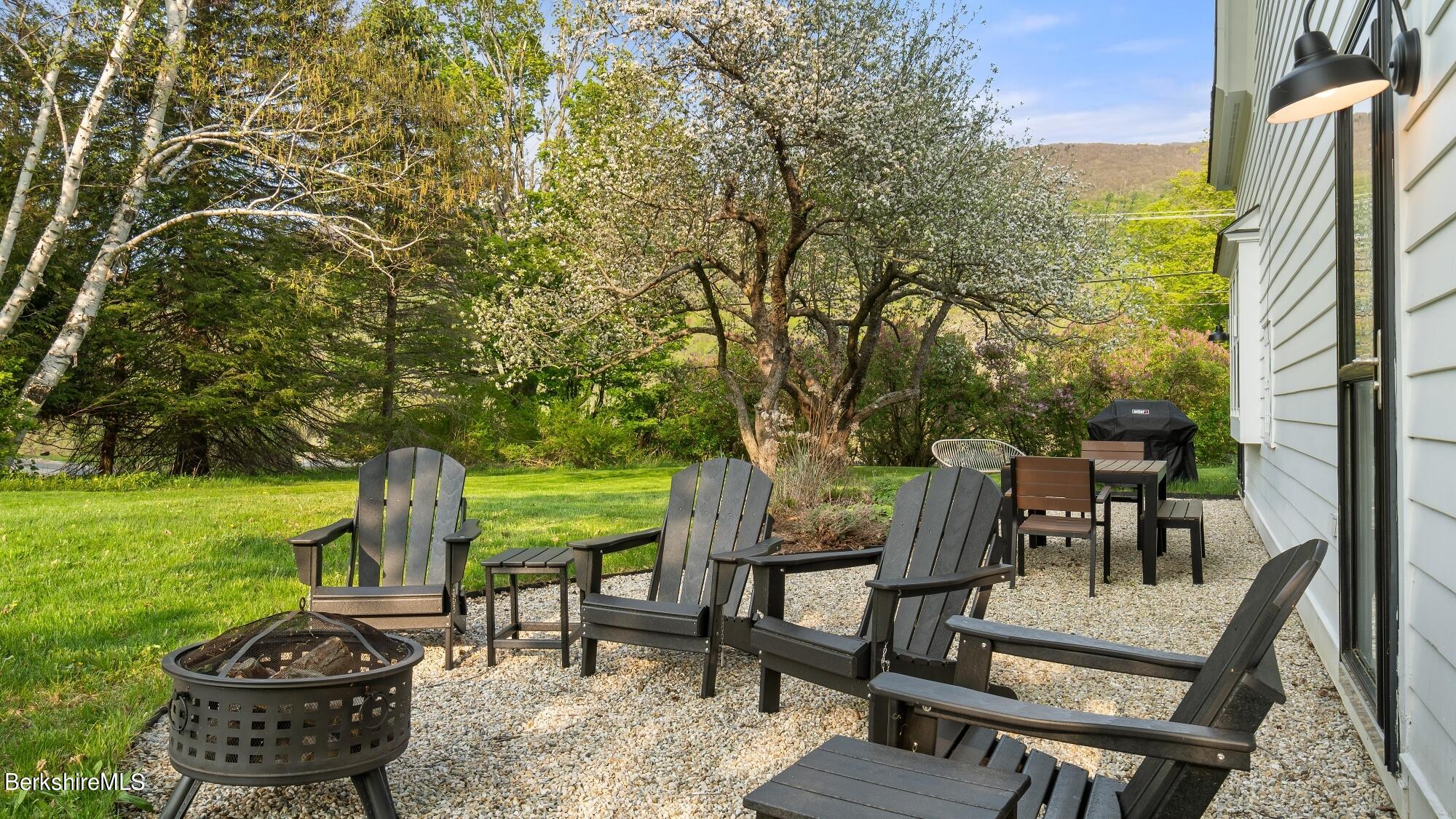 2325 Hancock Road Hancock, MA 01267 - Photo 58 of 61 a view of a patio with table and chairs and potted plants with large tree