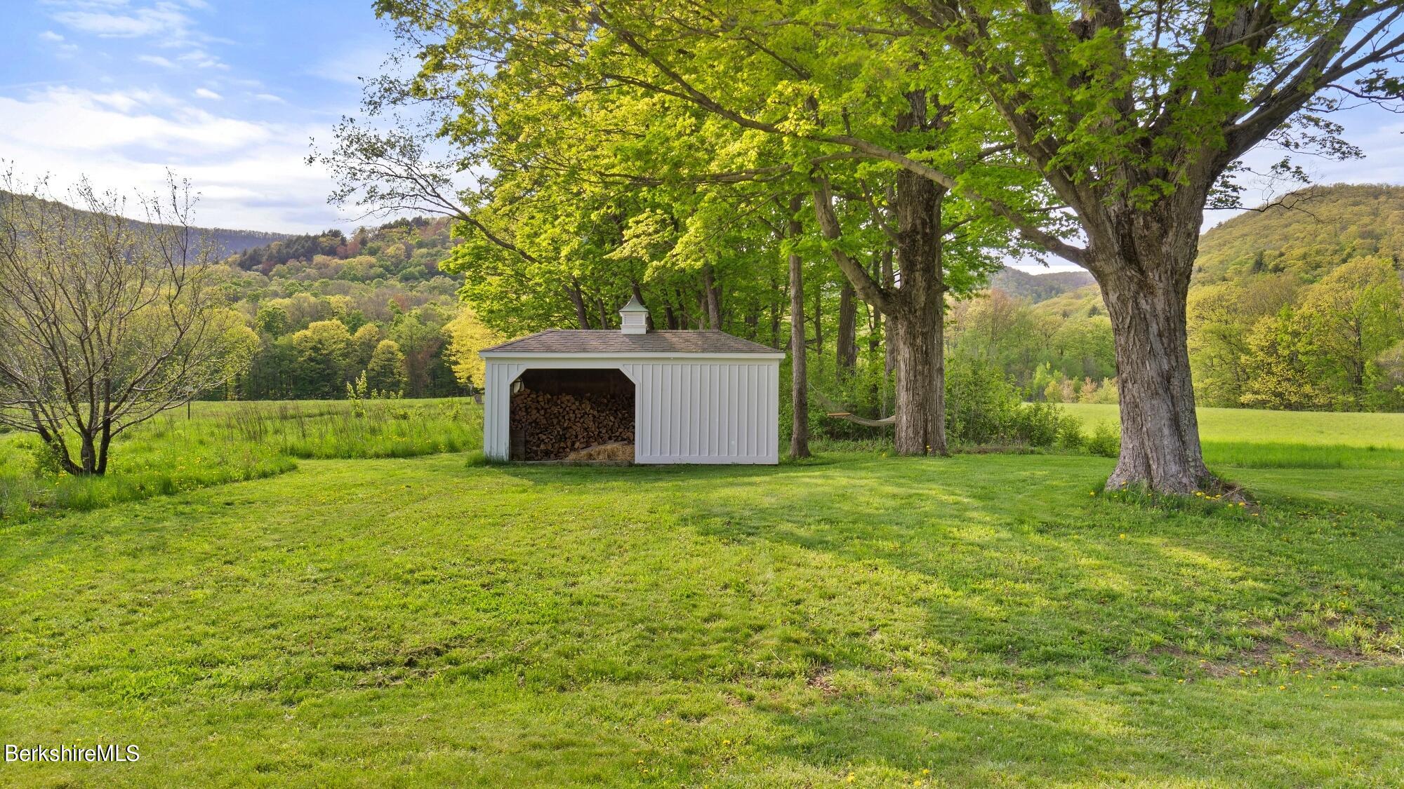 2325 Hancock Road Hancock, MA 01267 - Photo 59 of 61 a backyard of a house with lots of green space