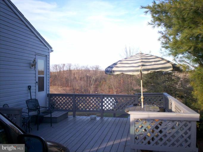 16204 Spade Road Hagerstown, MD 21740 - Photo 2 of 13 a backyard of a house with table and chairs