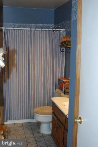 16204 Spade Road Hagerstown, MD 21740 - Photo 9 of 13 a bathroom with a sink toilet and shower