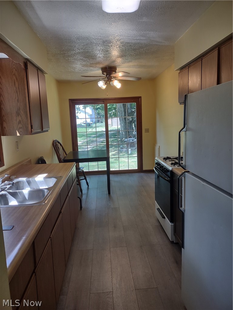 36250 Reeves Road Eastlake, OH 44095 - Photo 17 of 19 View of Kitchen from Living room. Glass slider to small deck area.