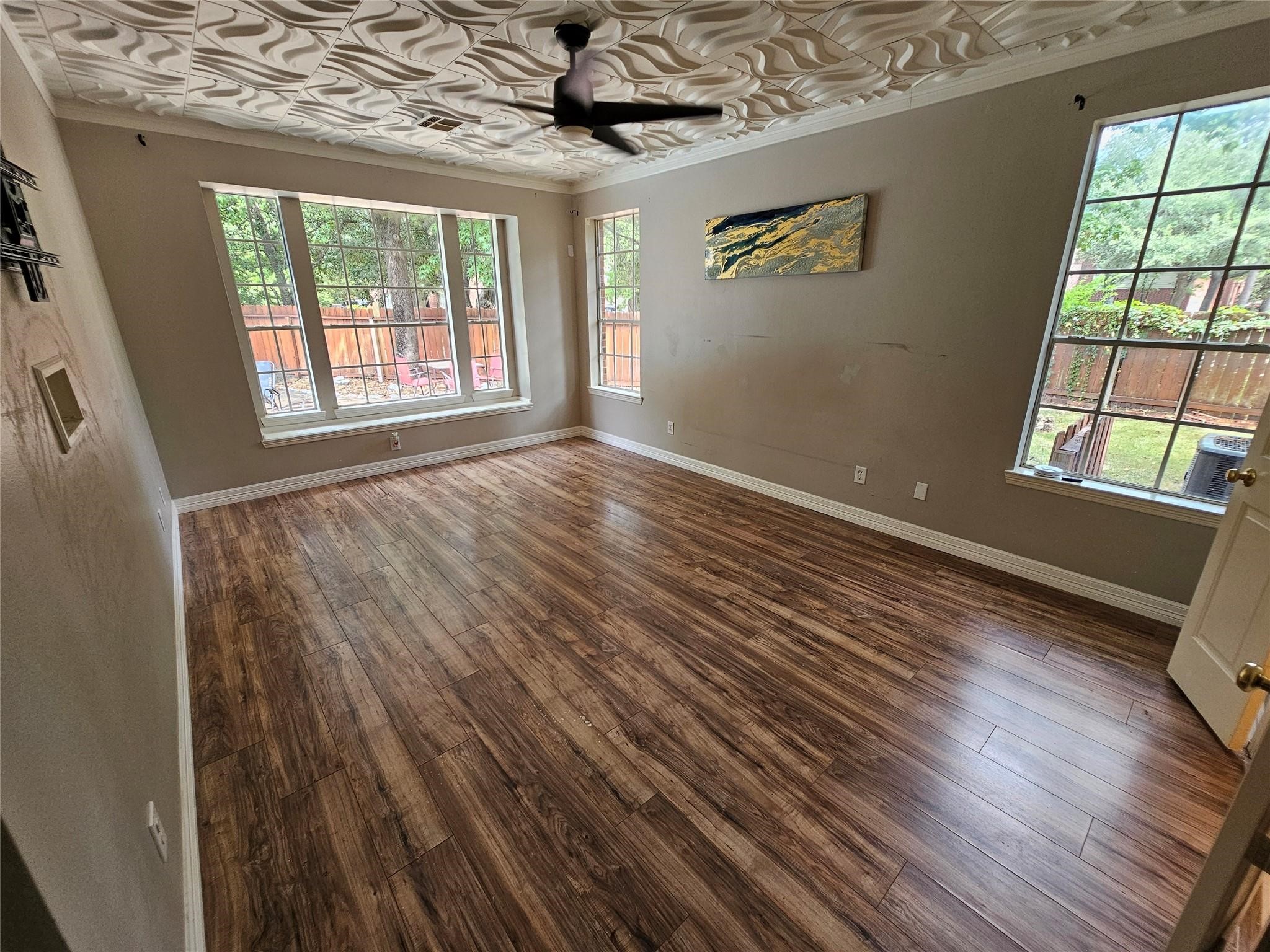 25606 Valley Springs Place Spring, TX 77373 - Photo 12 of 31 a view of an empty room with wooden floor and a window