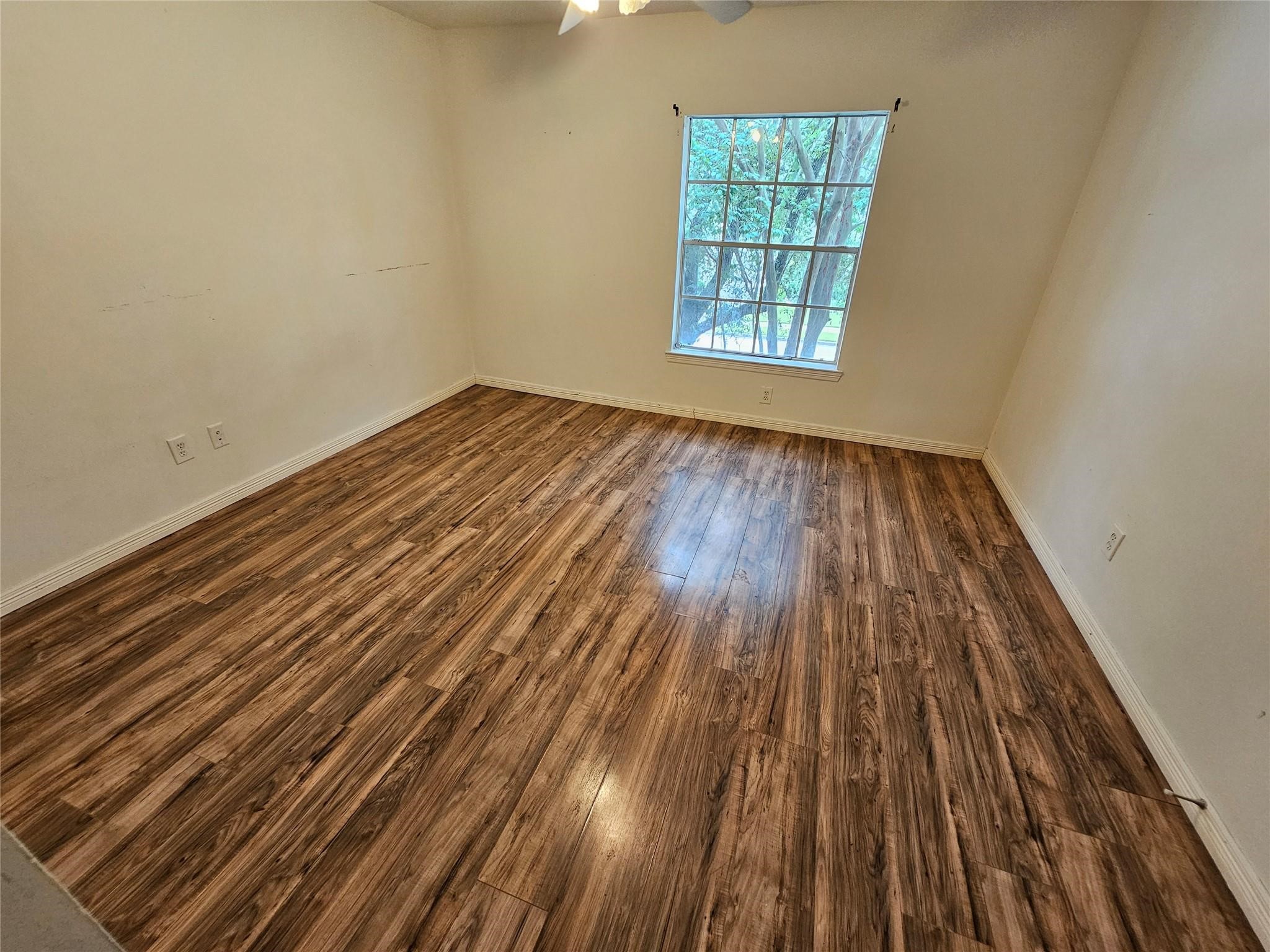 25606 Valley Springs Place Spring, TX 77373 - Photo 16 of 31 a view of a room with wooden floor and windows