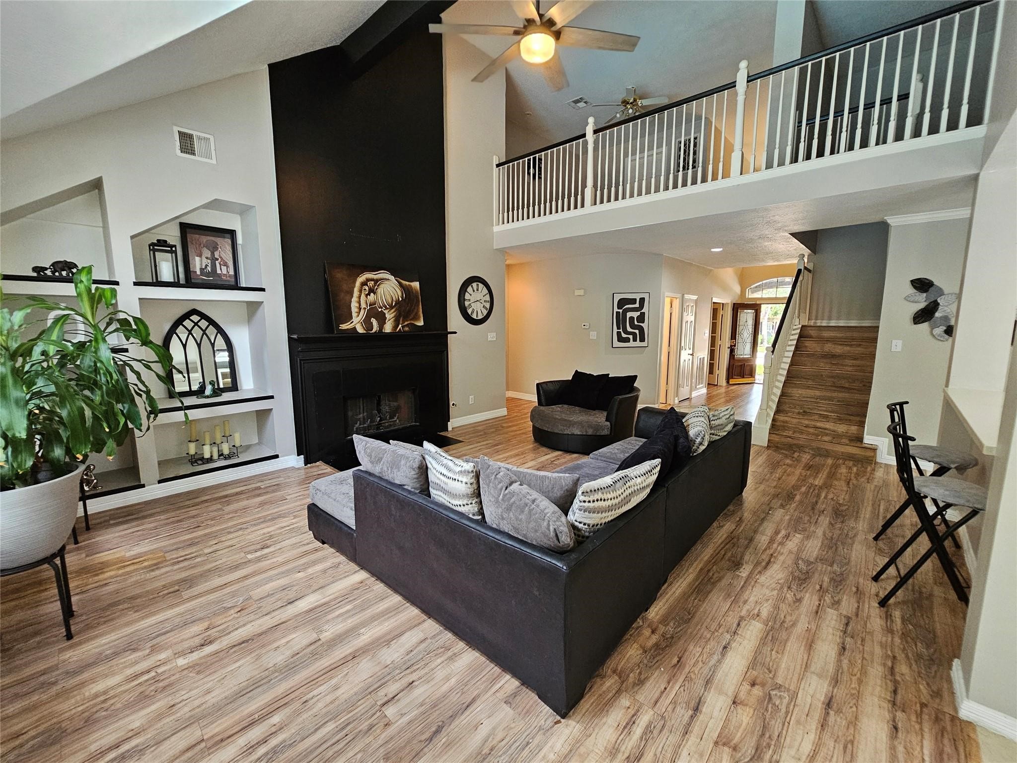 25606 Valley Springs Place Spring, TX 77373 - Photo 2 of 31 a living room with furniture and a wooden floor