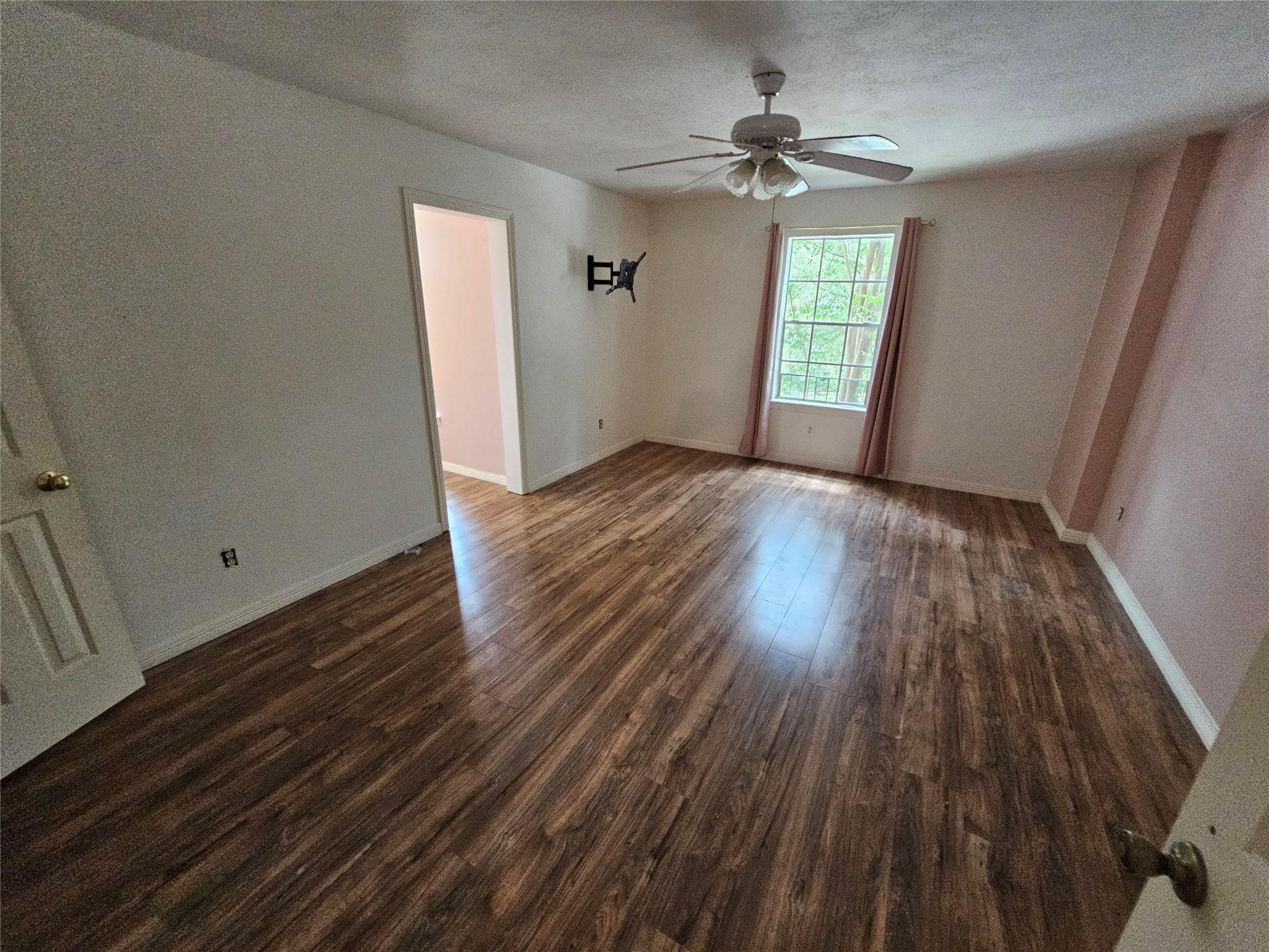 25606 Valley Springs Place Spring, TX 77373 - Photo 21 of 31 wooden floor in an empty room with a window
