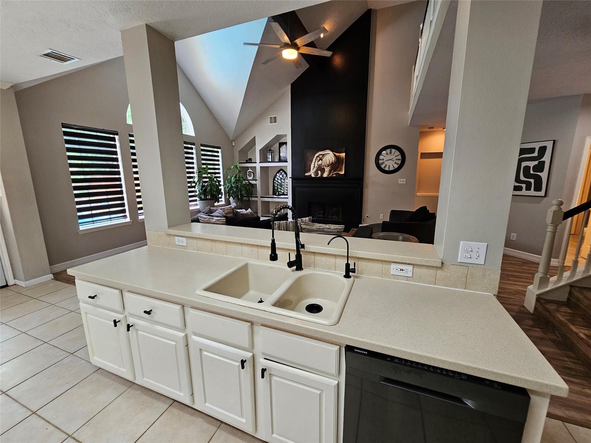 25606 Valley Springs Place Spring, TX 77373 - Photo 9 of 31 a kitchen with cabinets and window