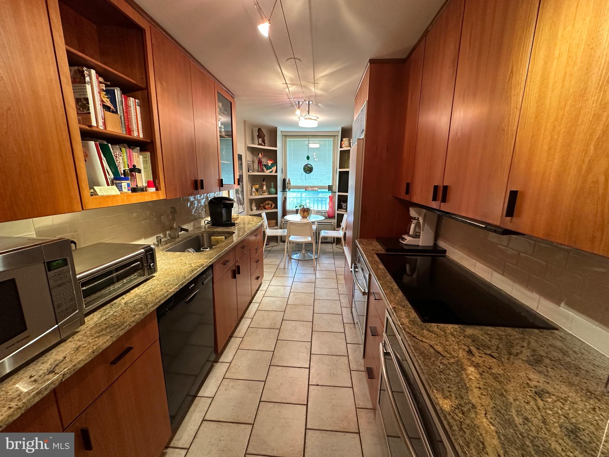 41 Conshohocken State Road, Unit 212 Bala Cynwyd, PA 19004 - Photo 8 of 33 kitchen with wood cabinetry