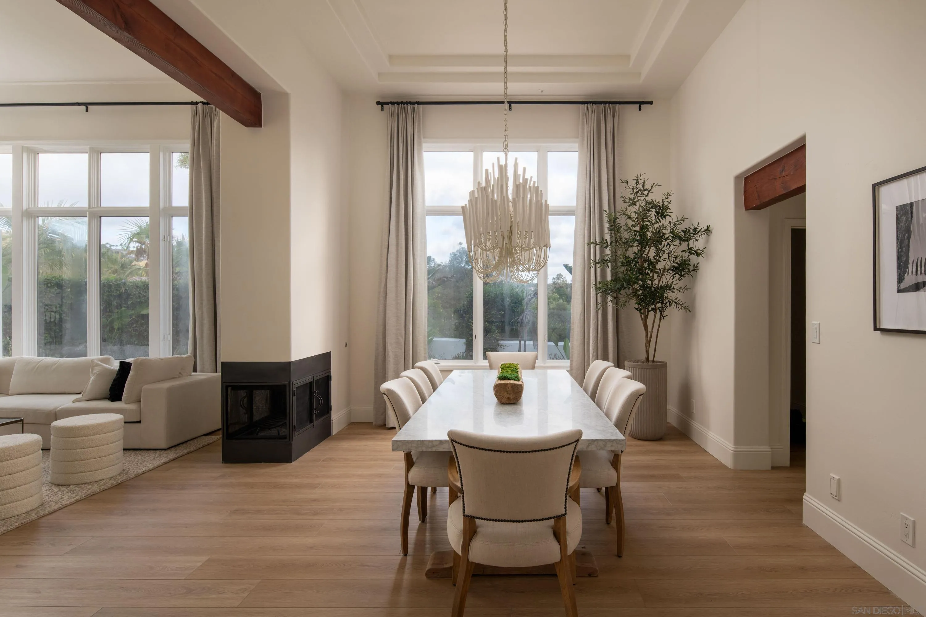 2815 Santa Fe Vista Court Encinitas, CA 92024 - Photo 22 of 74 a dining room with furniture a chandelier and wooden floor