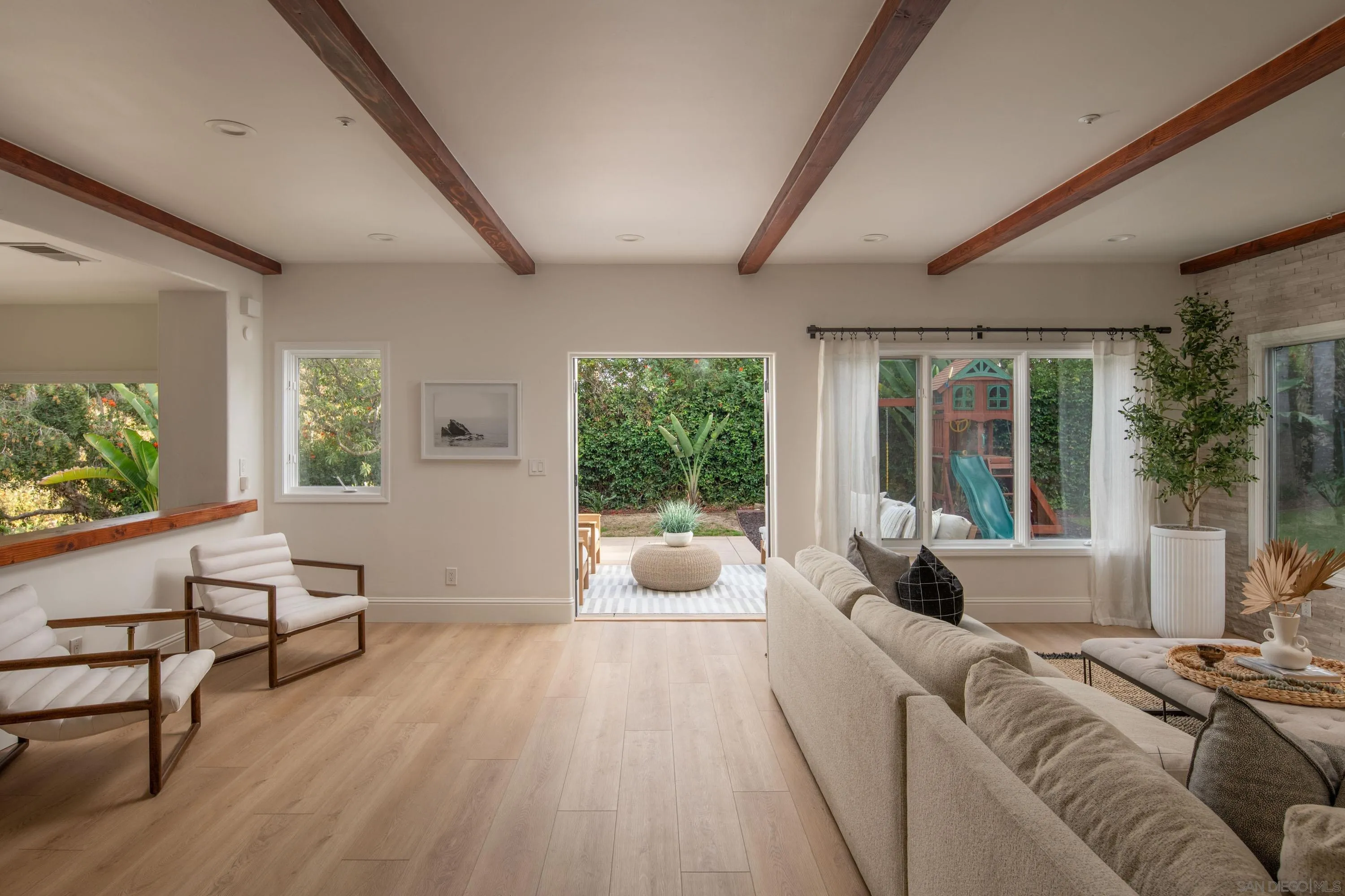 2815 Santa Fe Vista Court Encinitas, CA 92024 - Photo 24 of 74 a living room with furniture and a large window