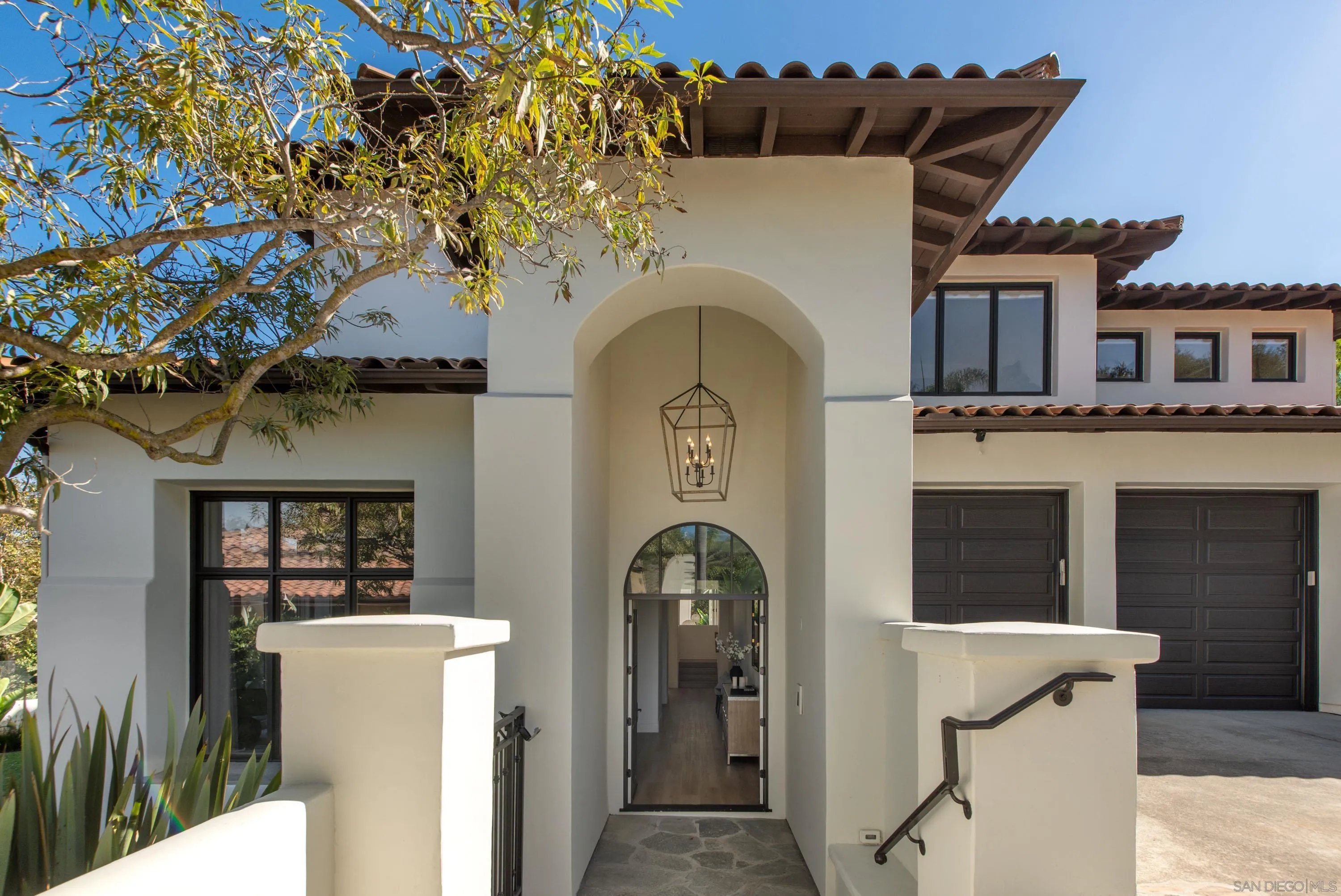 2815 Santa Fe Vista Court Encinitas, CA 92024 - Photo 65 of 74 a front view of a house with a tree