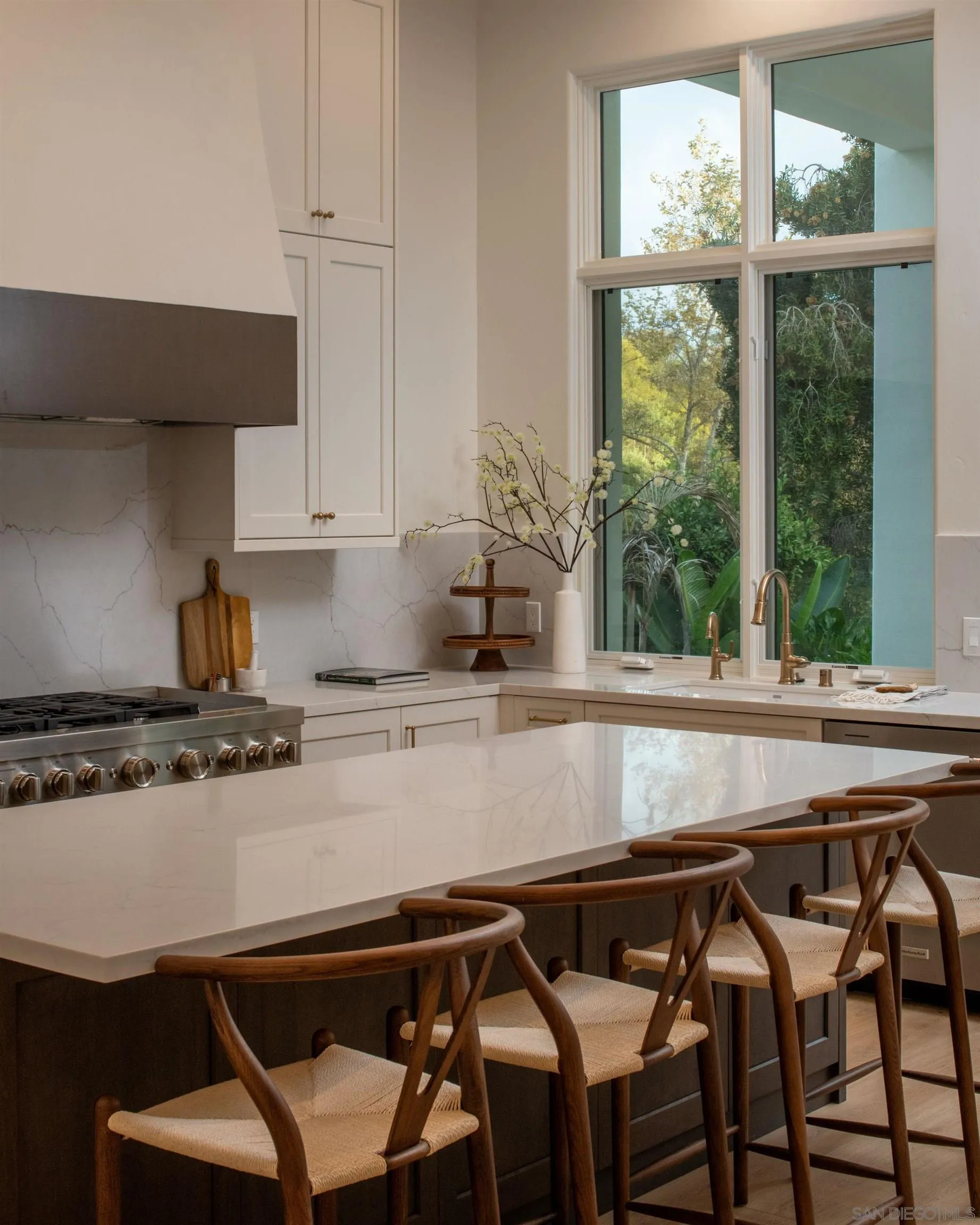 2815 Santa Fe Vista Court Encinitas, CA 92024 - Photo 10 of 74 a kitchen with a table chairs and a window