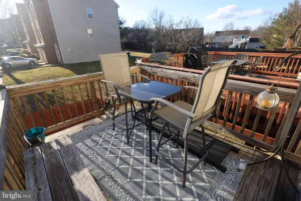 a view of a chairs and table in the balcony