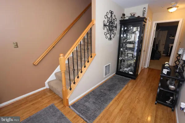 a view of an entryway with wooden floor