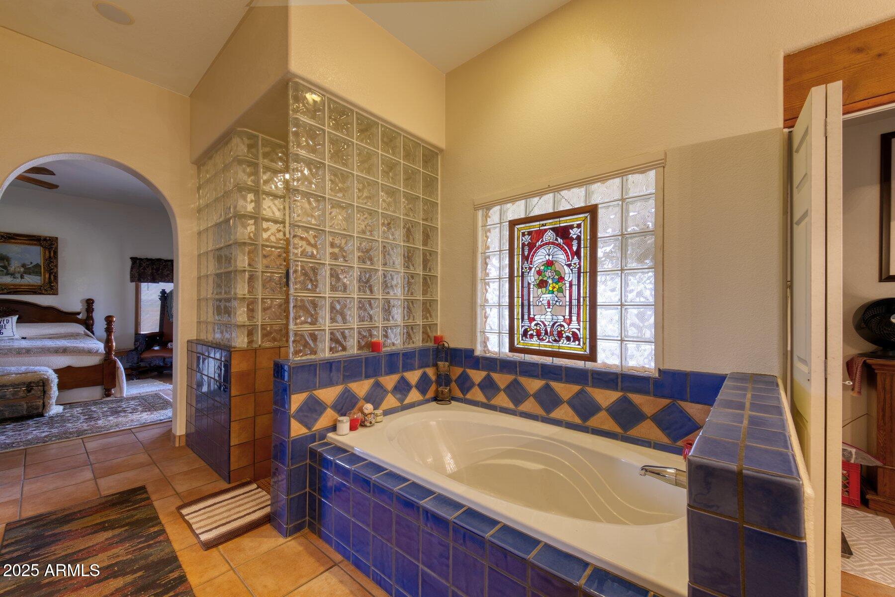 1426 South Foudy Road Bisbee, AZ 85603 - Photo 16 of 60 a spacious bathroom with a bathtub and a shower