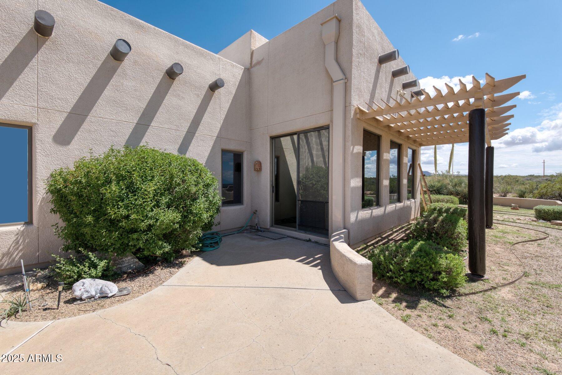 1426 South Foudy Road Bisbee, AZ 85603 - Photo 38 of 60 a view of a porch with plants and backyard