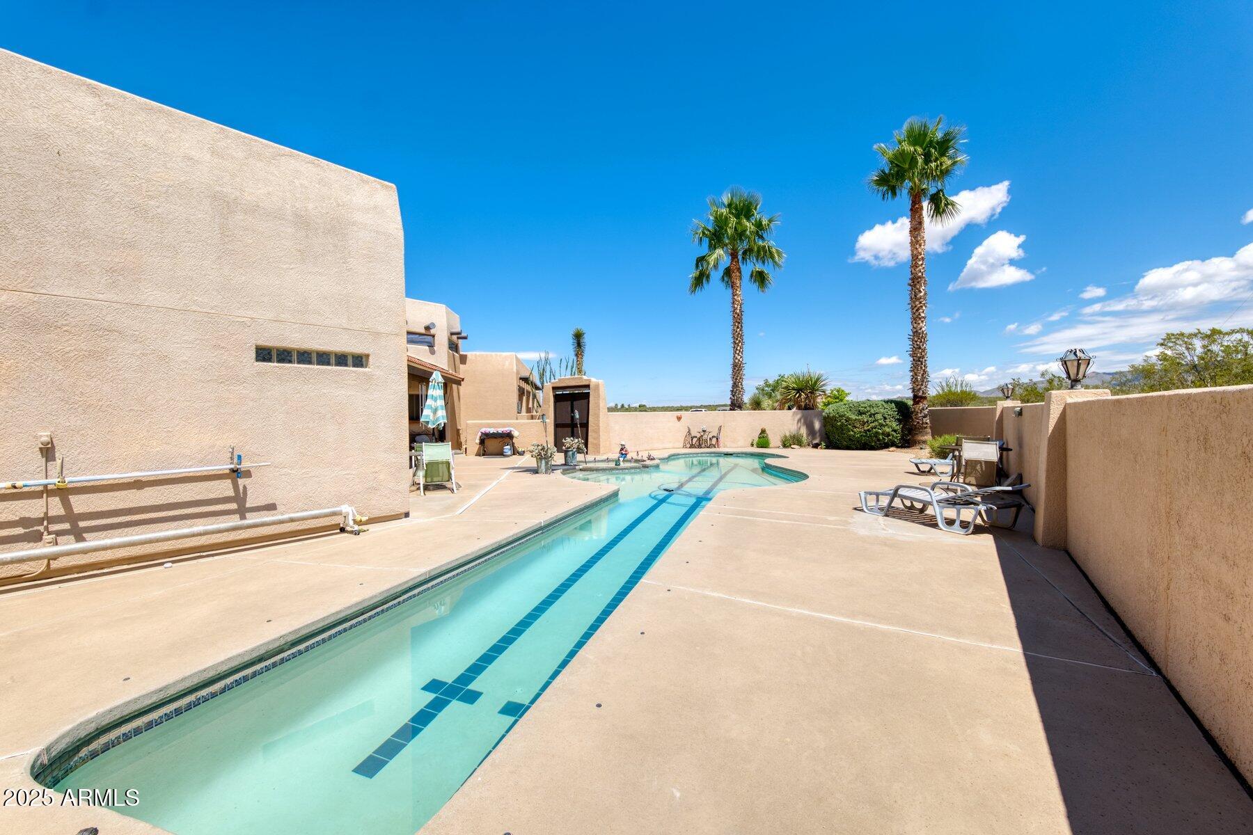 1426 South Foudy Road Bisbee, AZ 85603 - Photo 43 of 60 a view of a backyard with a swimming pool