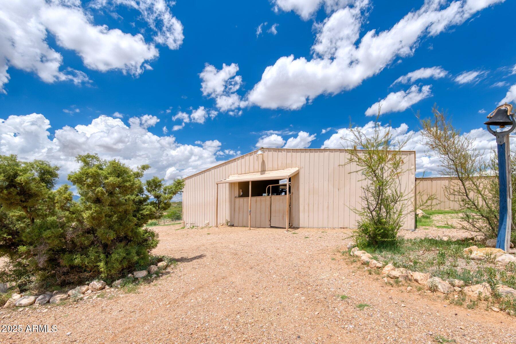 1426 South Foudy Road Bisbee, AZ 85603 - Photo 49 of 60 a view of a house with a yard