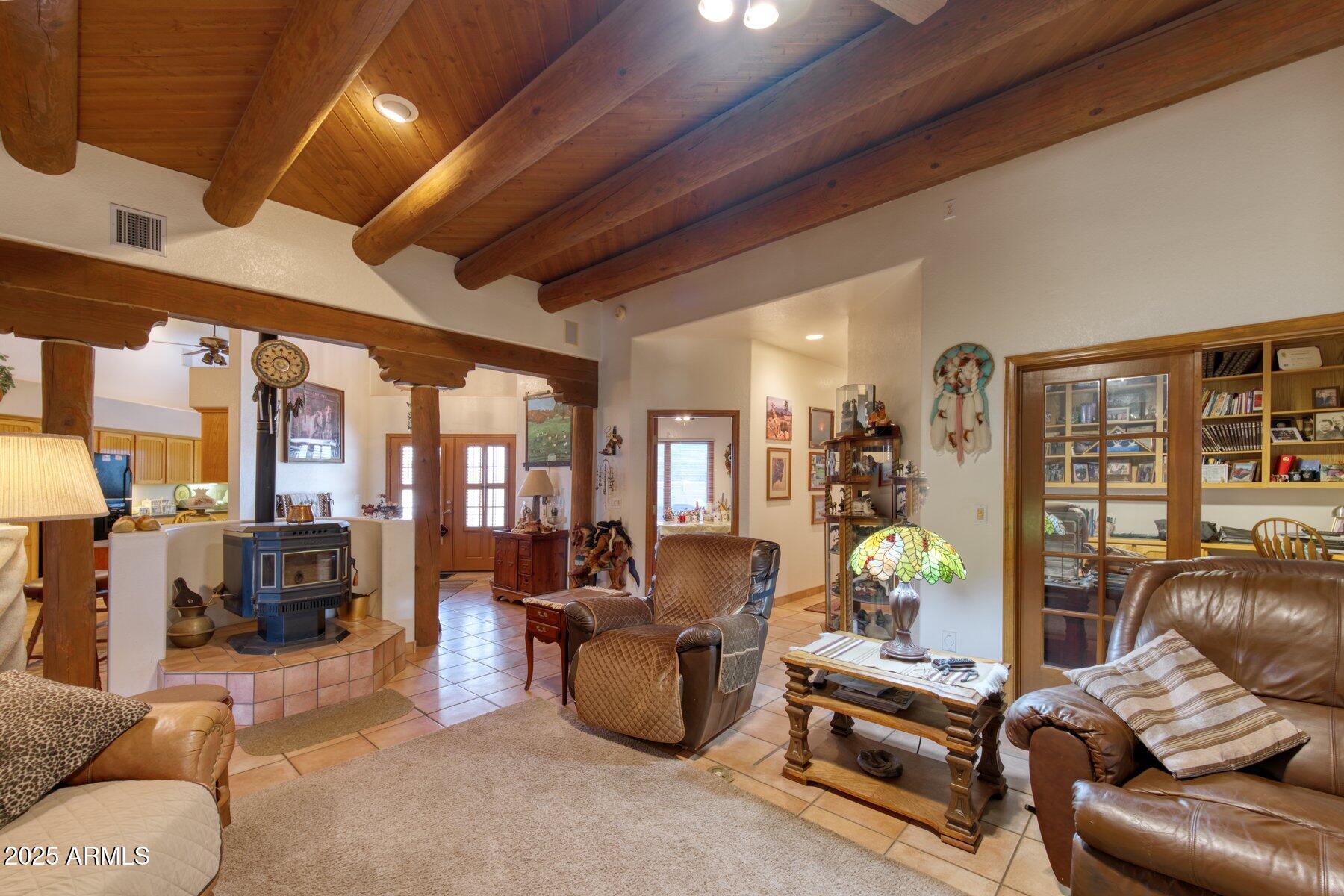 1426 South Foudy Road Bisbee, AZ 85603 - Photo 5 of 60 a living room with furniture and a floor to ceiling window