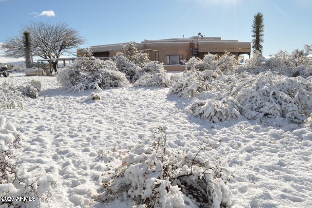 1426 South Foudy Road Bisbee, AZ 85603 - Photo 60 of 60 a view of a dry yard with wooden fence
