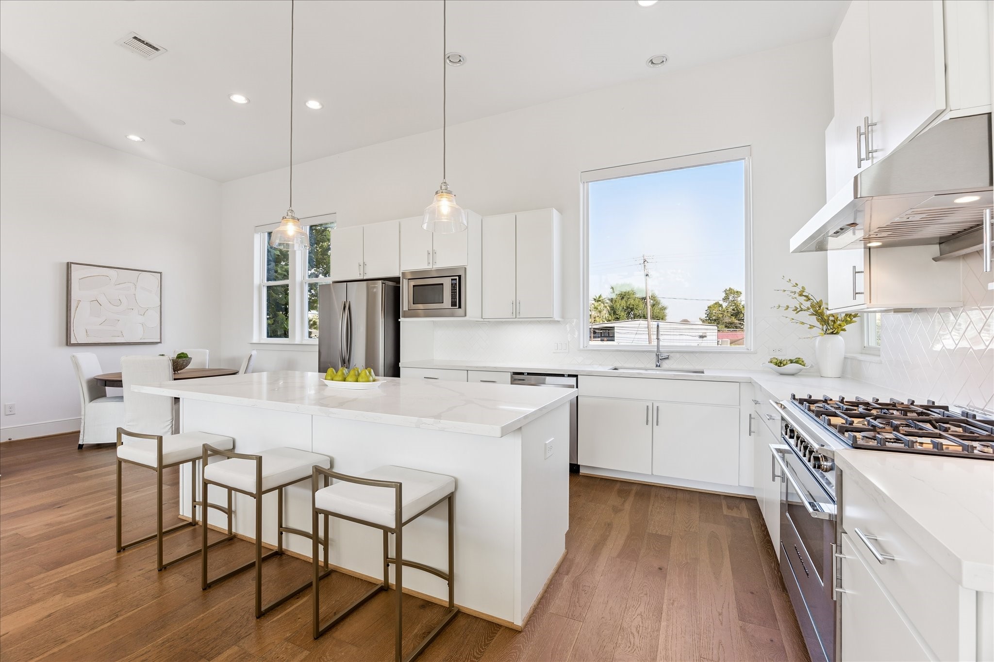 2414 Canal Street, Unit F Houston, TX 77003 - Photo 12 of 34 a kitchen with a sink a counter top space stainless steel appliances and cabinets