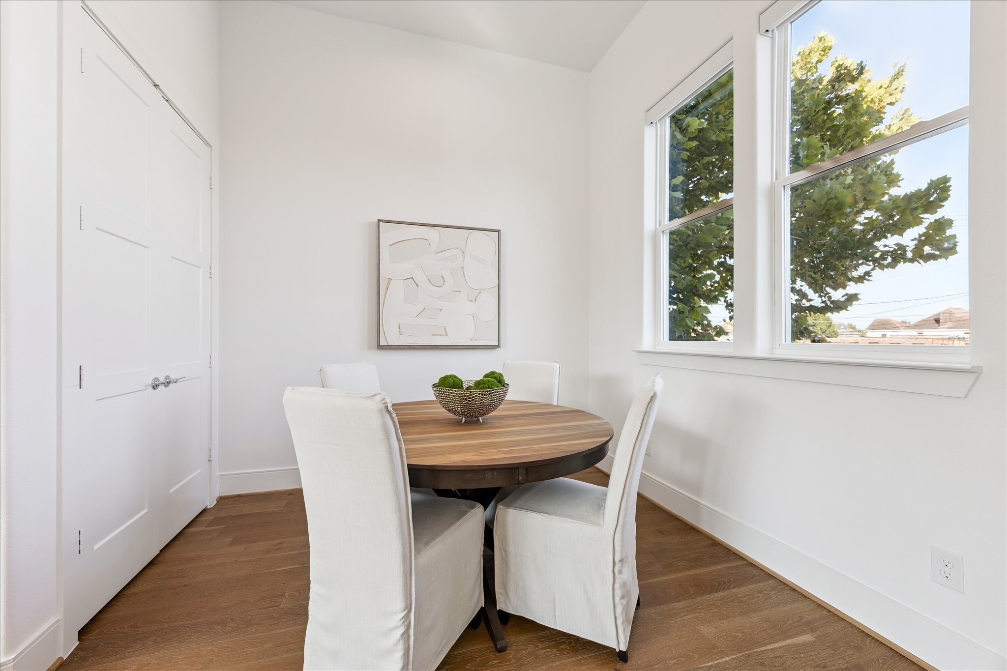 2414 Canal Street, Unit F Houston, TX 77003 - Photo 13 of 34 a view of a dining room with furniture and wooden floor