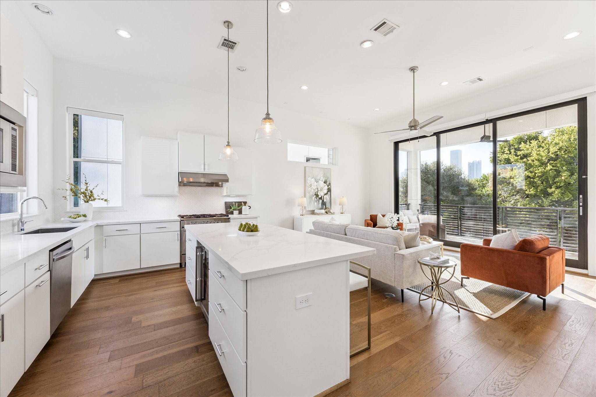 2414 Canal Street, Unit F Houston, TX 77003 - Photo 17 of 34 a open kitchen with stainless steel appliances granite countertop a lot of counter space and a wooden floors