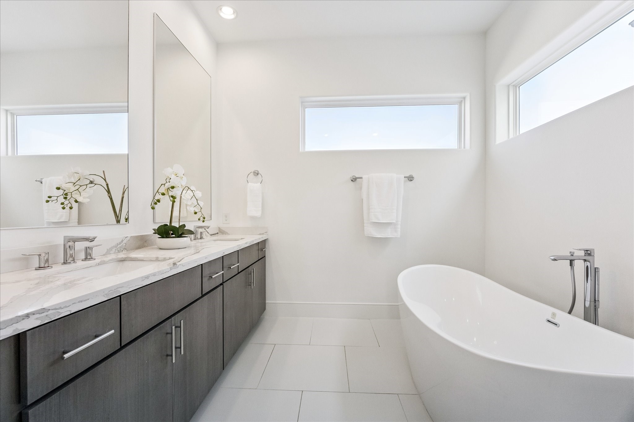 2414 Canal Street, Unit F Houston, TX 77003 - Photo 22 of 34 a bathroom with a granite countertop sink a toilet and mirror