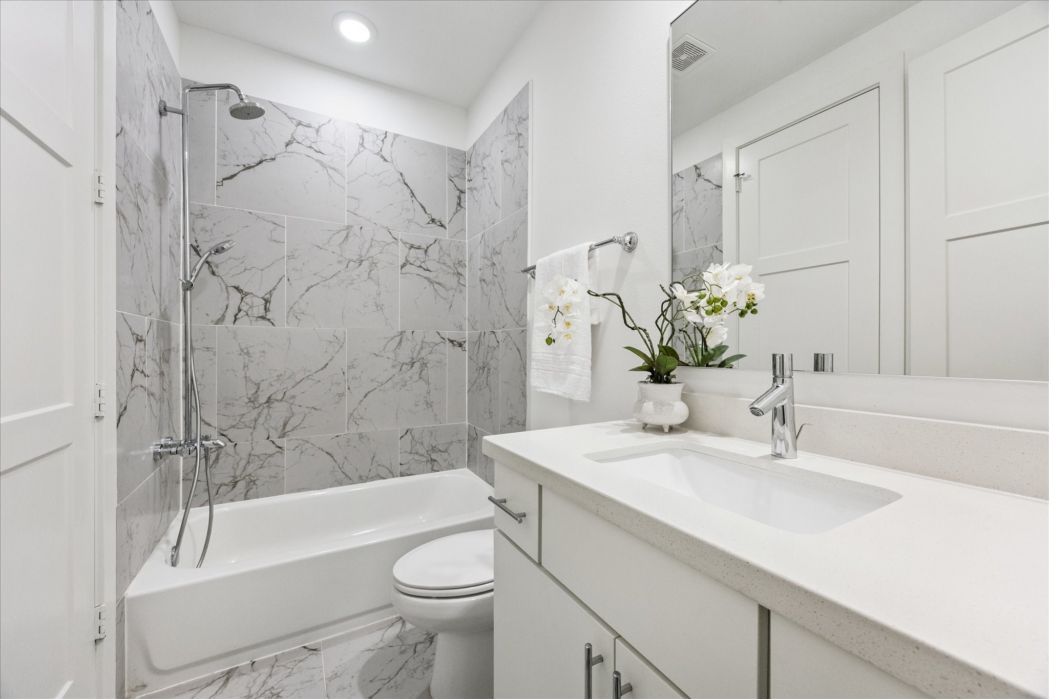 2414 Canal Street, Unit F Houston, TX 77003 - Photo 27 of 34 a bathroom with a sink a toilet and shower