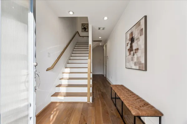 a view of entryway with wooden floor