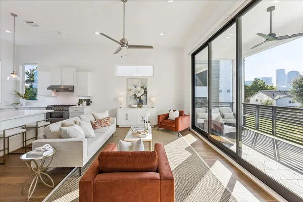 a living room with furniture and a large window