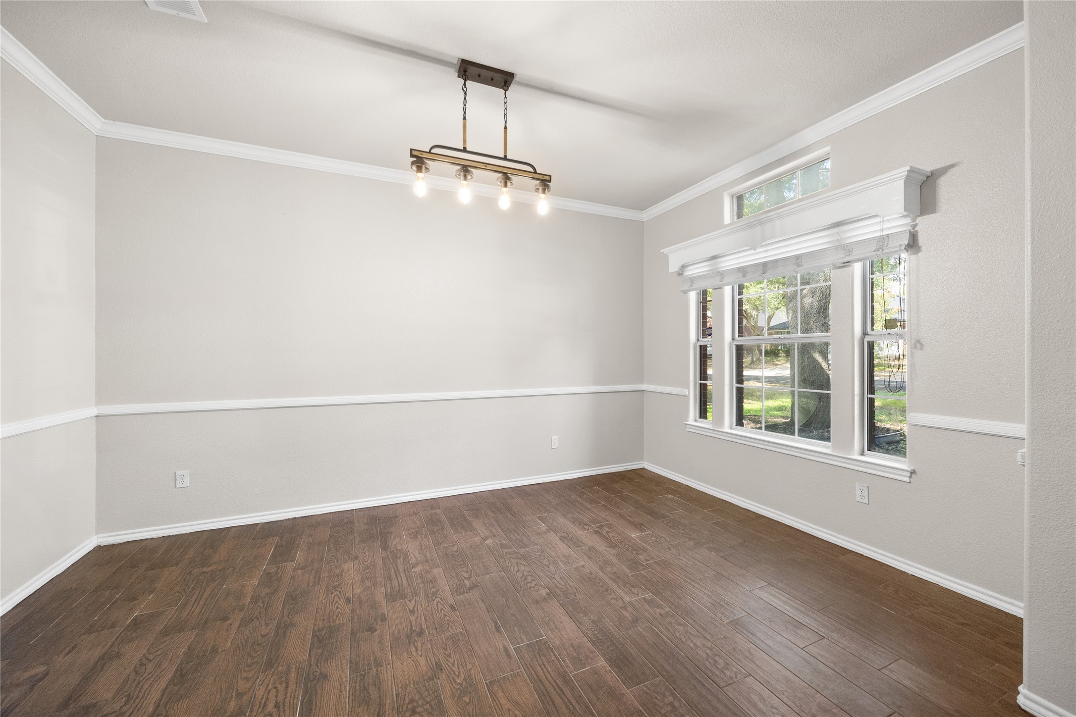 13217 Rochester Lane Austin, TX 78753 - Photo 14 of 30 Gleaming hardwood floors and classic crown molding define this versatile dining space.