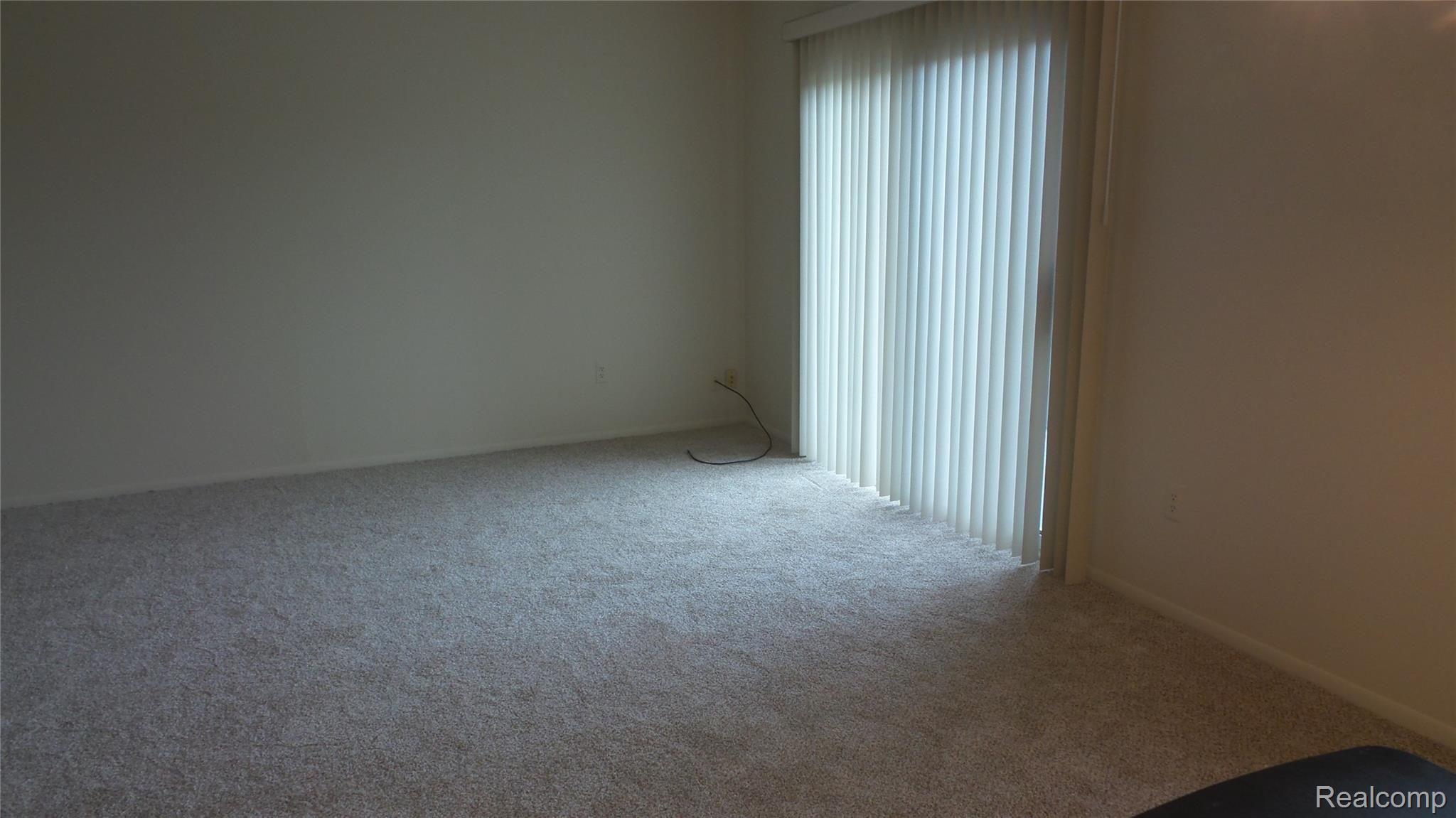 1516 Normandy Road, Unit 201 Royal Oak, MI 48073 - Photo 7 of 22 Living Room View with Door leading to Balcony