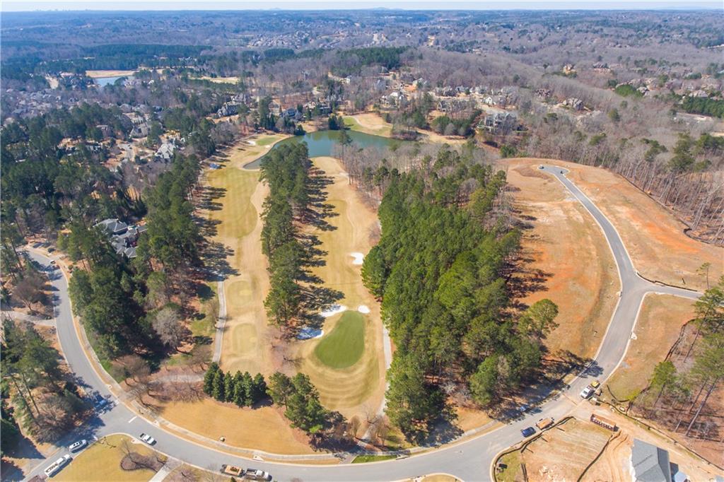 4921 Roaring Fork Pass Suwanee, GA 30024 - Photo 9 of 9 an aerial view of residential houses with outdoor space