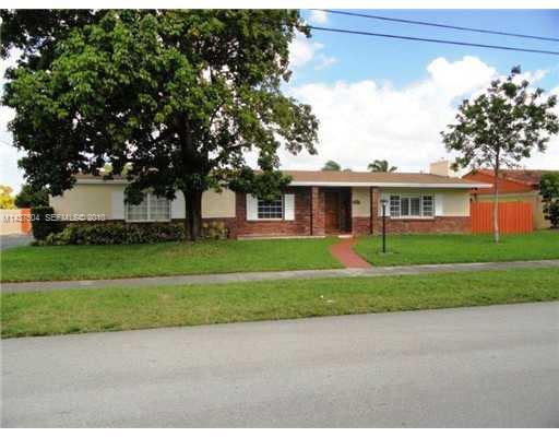 9261 Southwest 88th Terrace Miami, FL 33173 - Photo 1 of 16 a view of a house next to a big yard and large trees