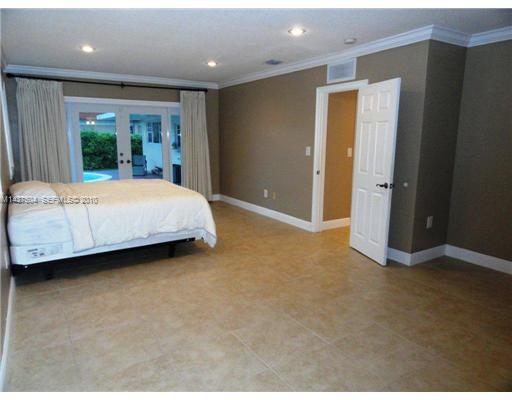 9261 Southwest 88th Terrace Miami, FL 33173 - Photo 6 of 16 a room with a bed and a view of en suite bathroom