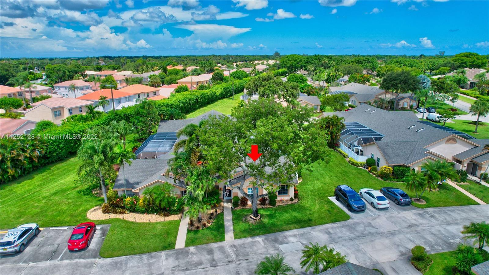 Boca Gardens Boca Raton, FL 33496 - Photo 13 of 19 a view of a garden with a building in the background