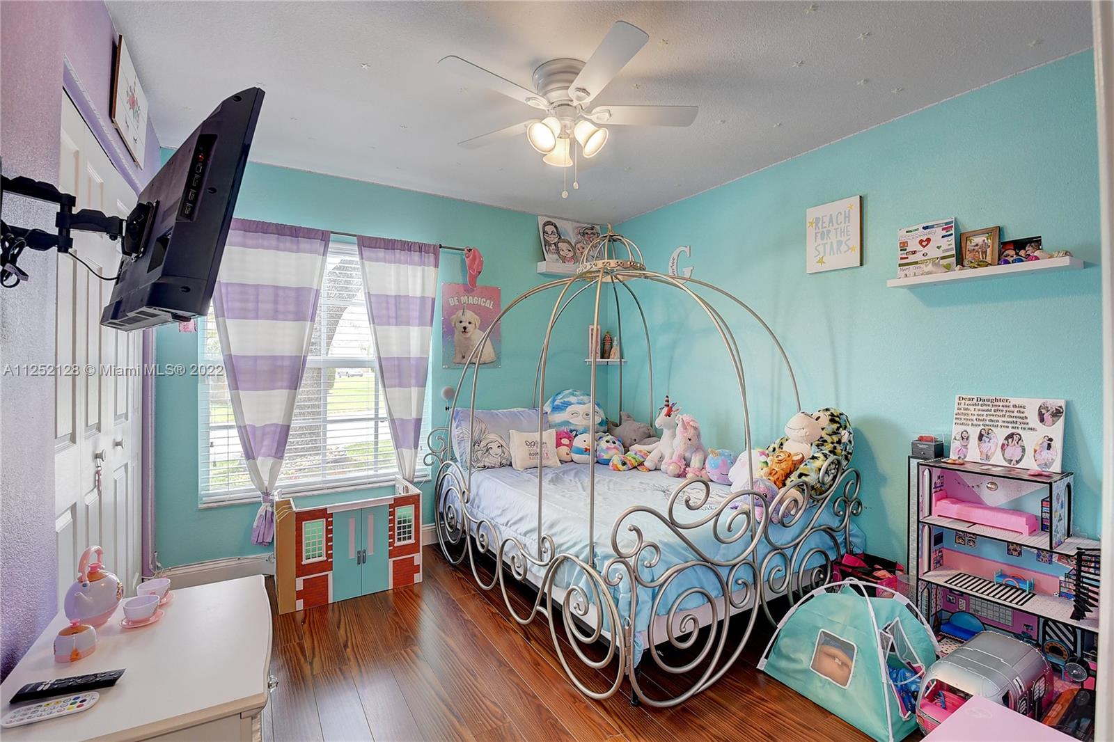 Boca Gardens Boca Raton, FL 33496 - Photo 9 of 19 a bedroom with furniture and a baby crib