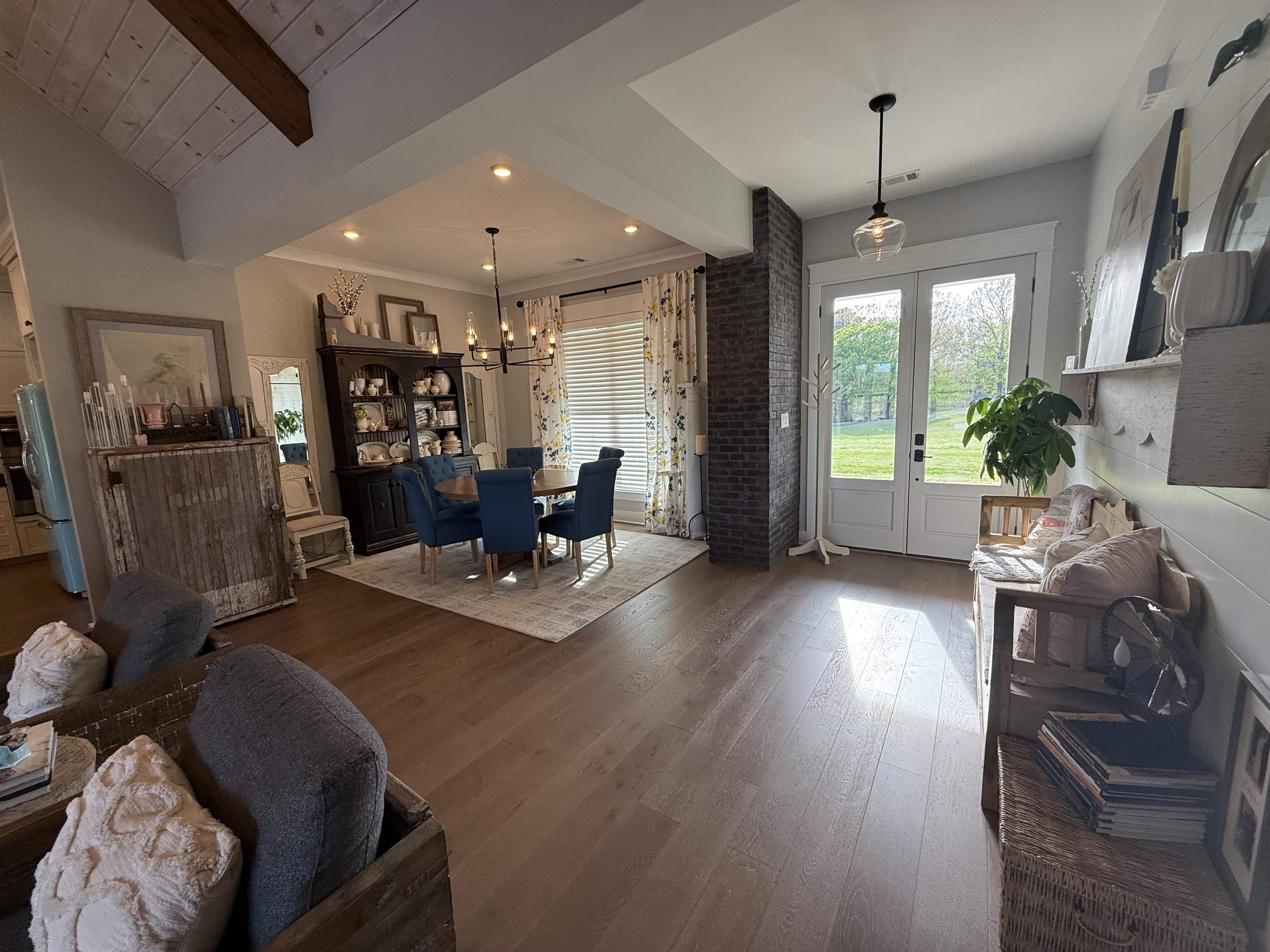 6900 Salem Road Lakeland, TN 38002 - Photo 14 of 40 Living room with beam ceiling, french doors, dark wood-type flooring, and suspended lighting
