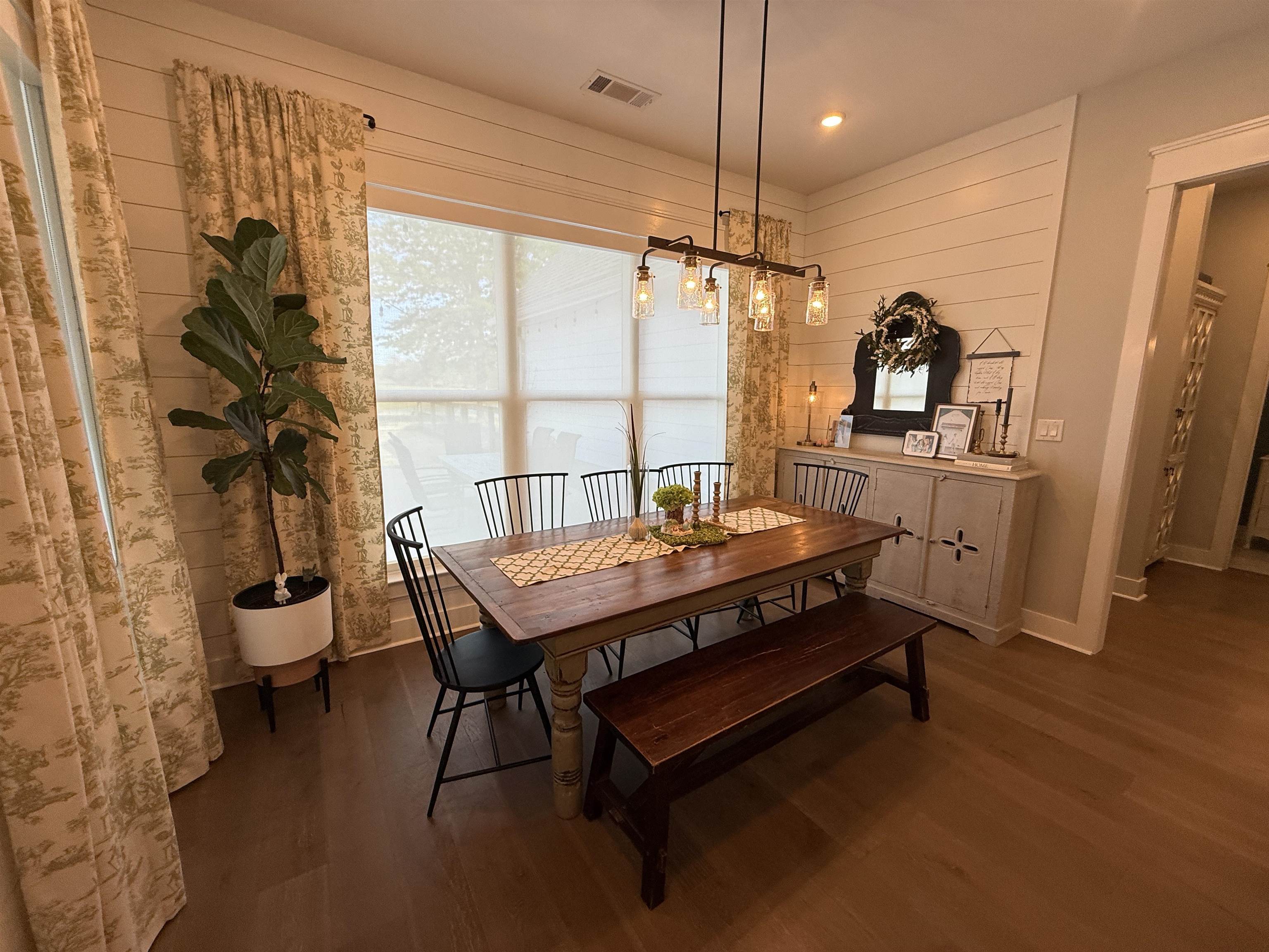 6900 Salem Road Lakeland, TN 38002 - Photo 20 of 40 Dining room with dark wood-style flooring, wooden walls, and recessed lighting