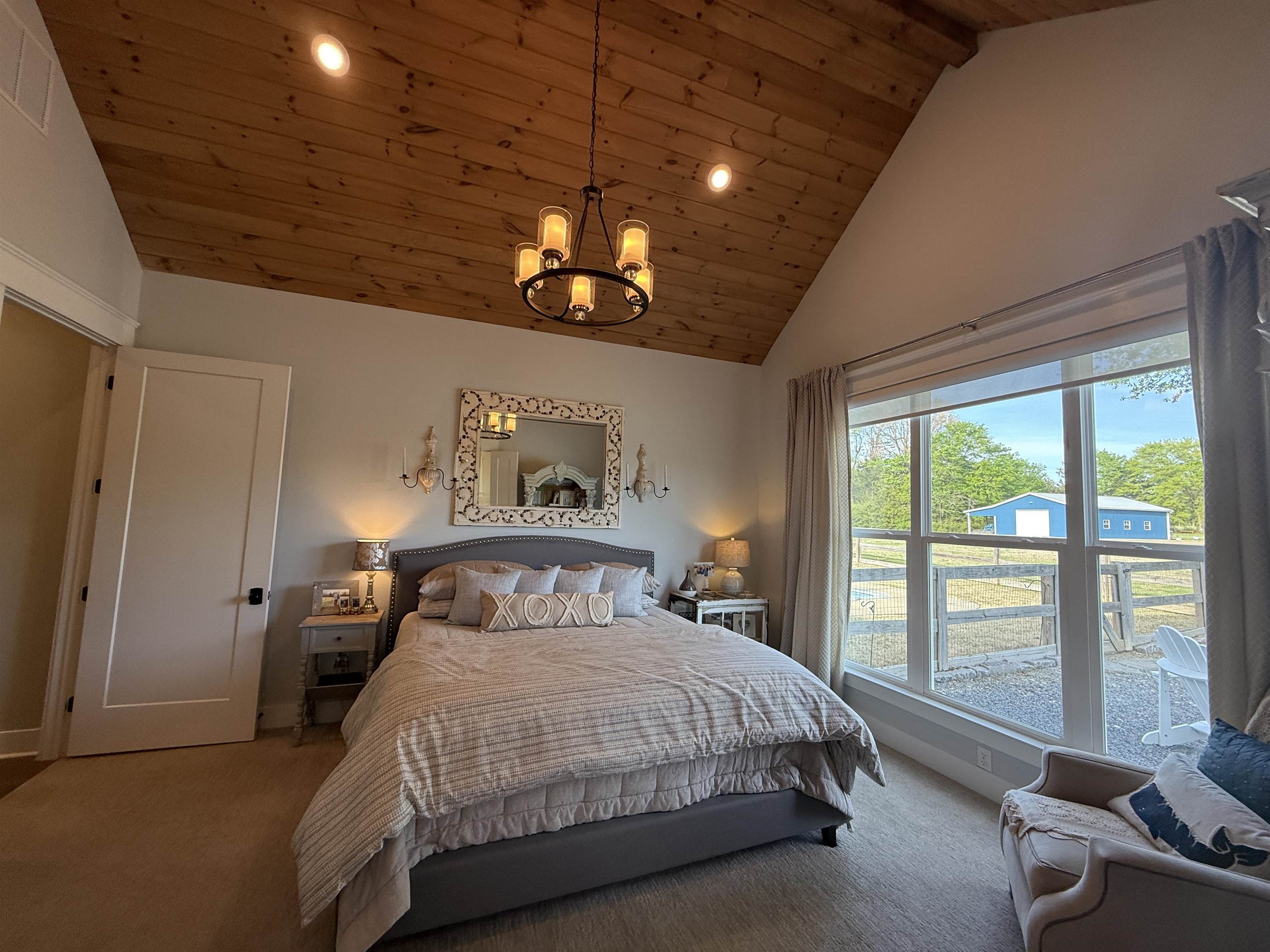 6900 Salem Road Lakeland, TN 38002 - Photo 21 of 40 Bedroom featuring a vaulted wooden ceiling, carpet floors, and hanging lights