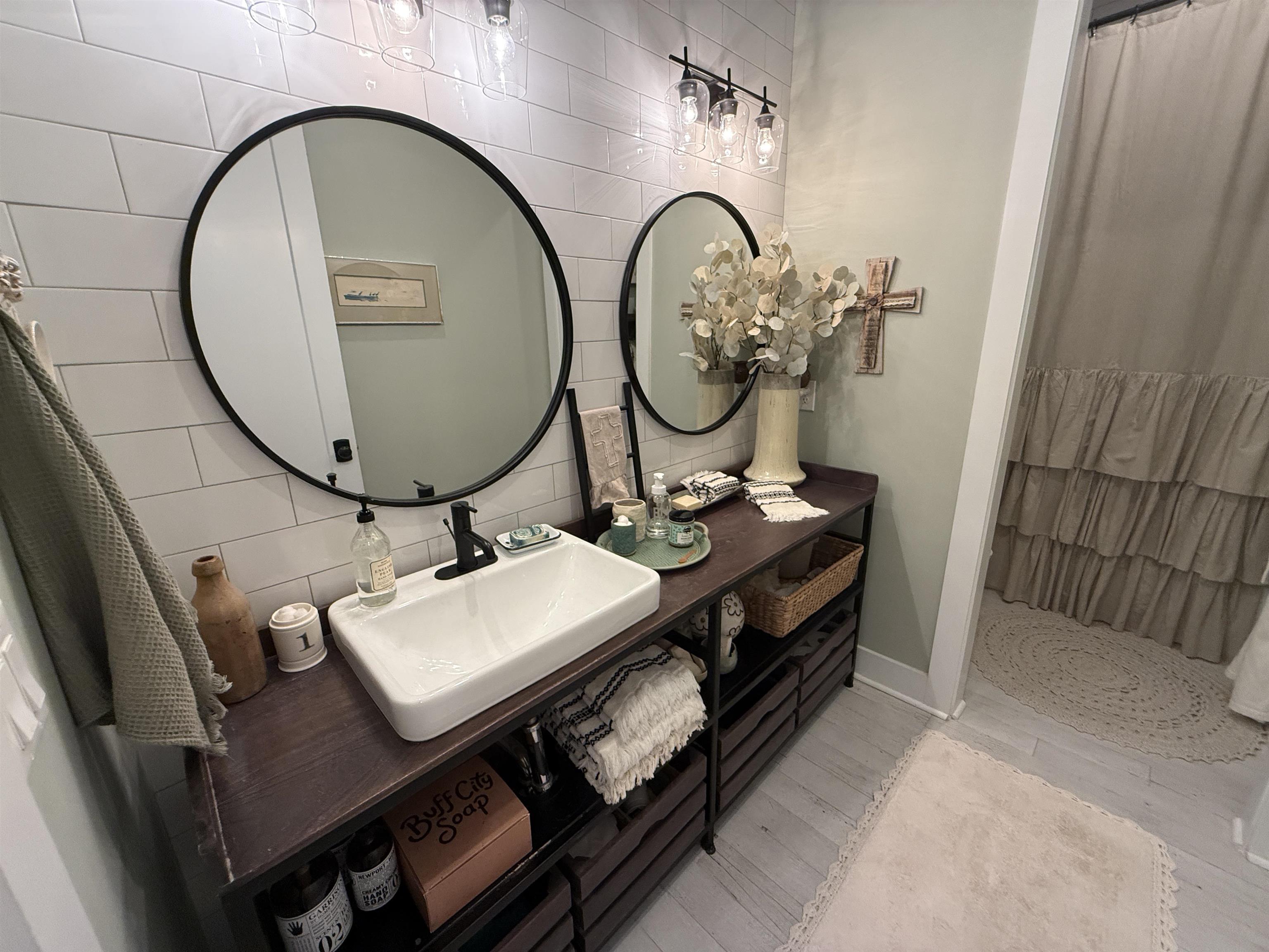 6900 Salem Road Lakeland, TN 38002 - Photo 32 of 40 Full bath featuring curtained shower, tile walls, vanity, and light wood-type flooring