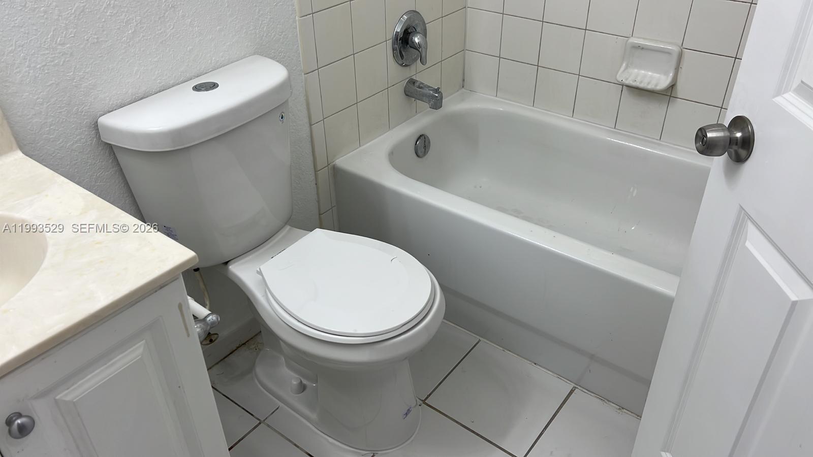 1953 Freeport Drive, Unit 1953 Riviera Beach, FL 33404 - Photo 15 of 30 a bathroom with a sink and toilet