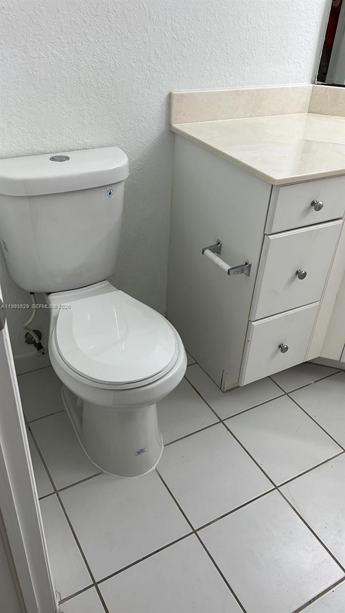 1953 Freeport Drive, Unit 1953 Riviera Beach, FL 33404 - Photo 18 of 30 a bathroom with a toilet and a sink