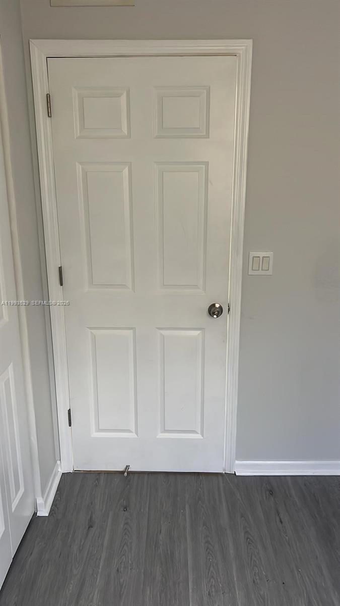 1953 Freeport Drive, Unit 1953 Riviera Beach, FL 33404 - Photo 20 of 30 a view of an empty room with wooden floor