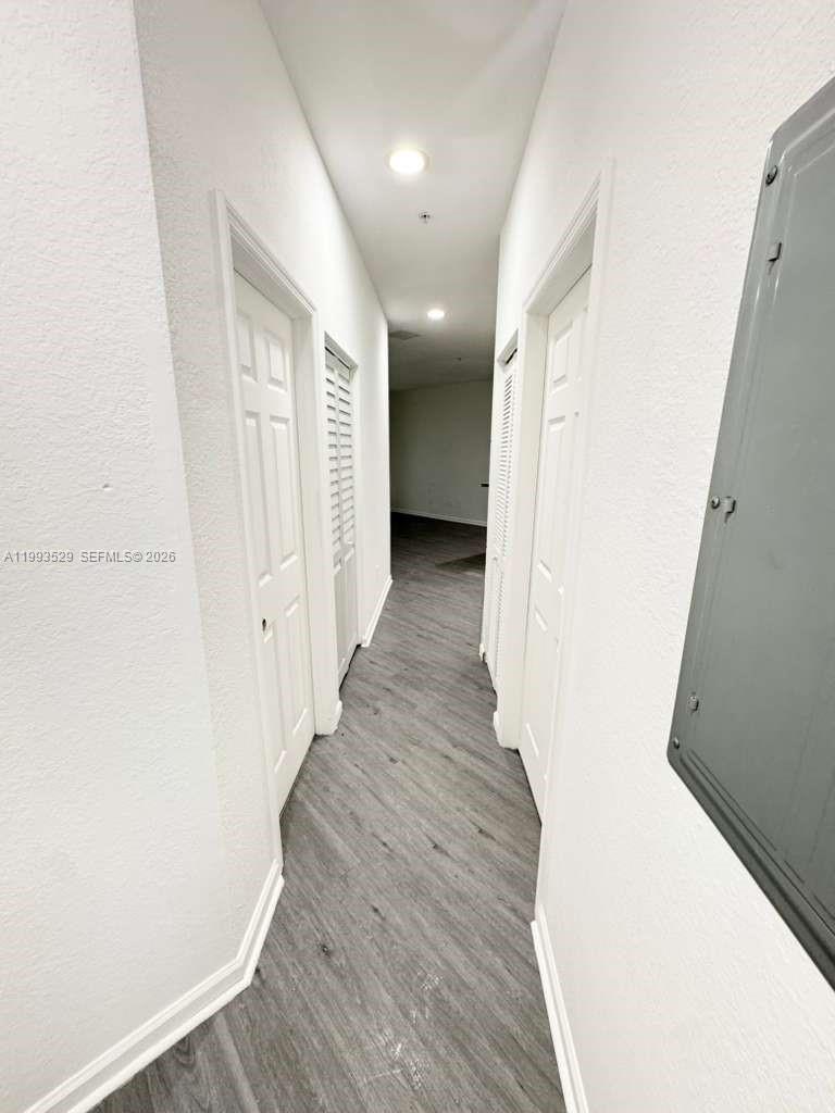 1953 Freeport Drive, Unit 1953 Riviera Beach, FL 33404 - Photo 30 of 30 a view of a hallway with wooden floor
