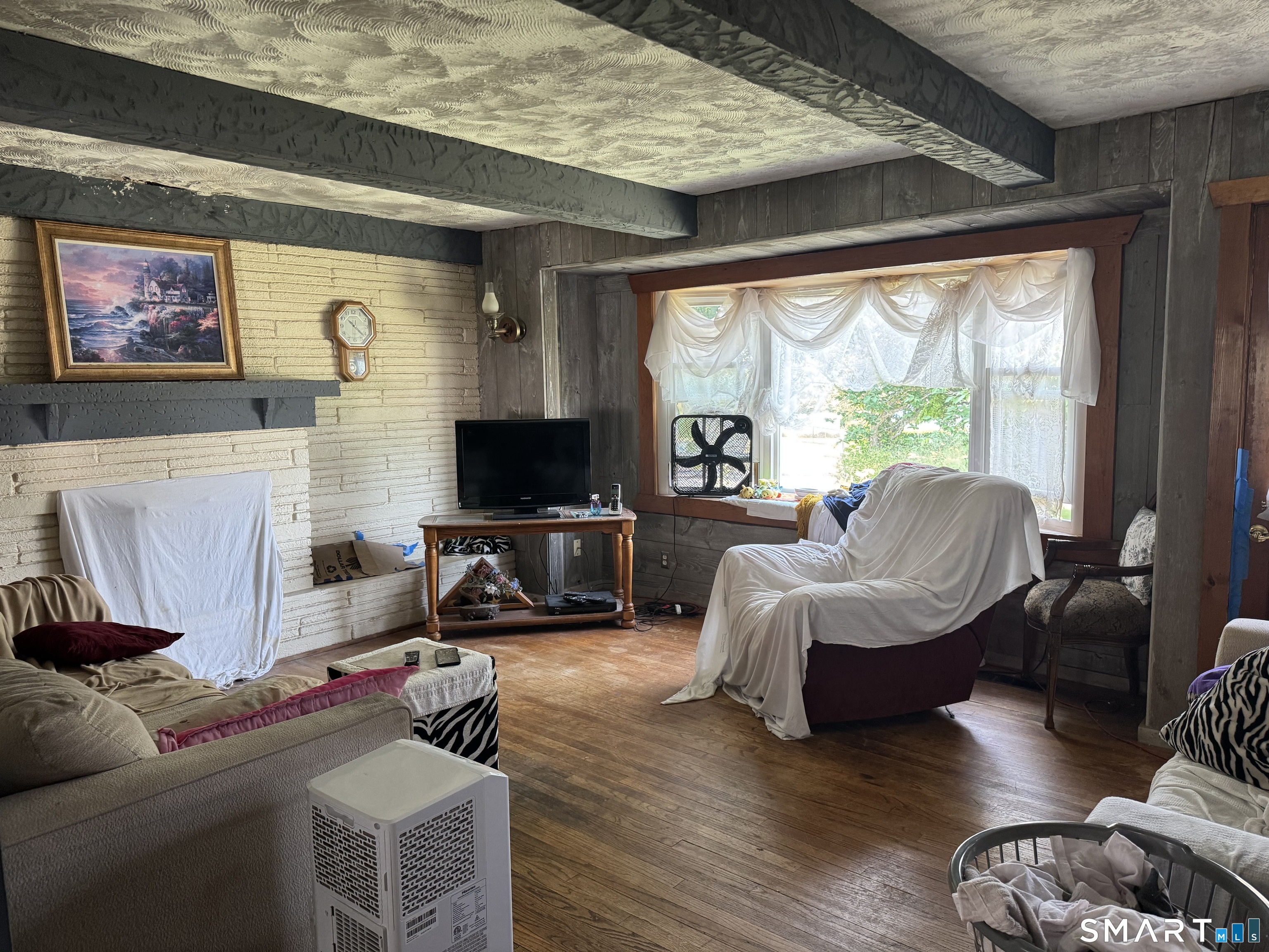 36 Pleasant View Road Derby, CT 06418 - Photo 10 of 20 a living room with furniture a large window and a flat screen tv