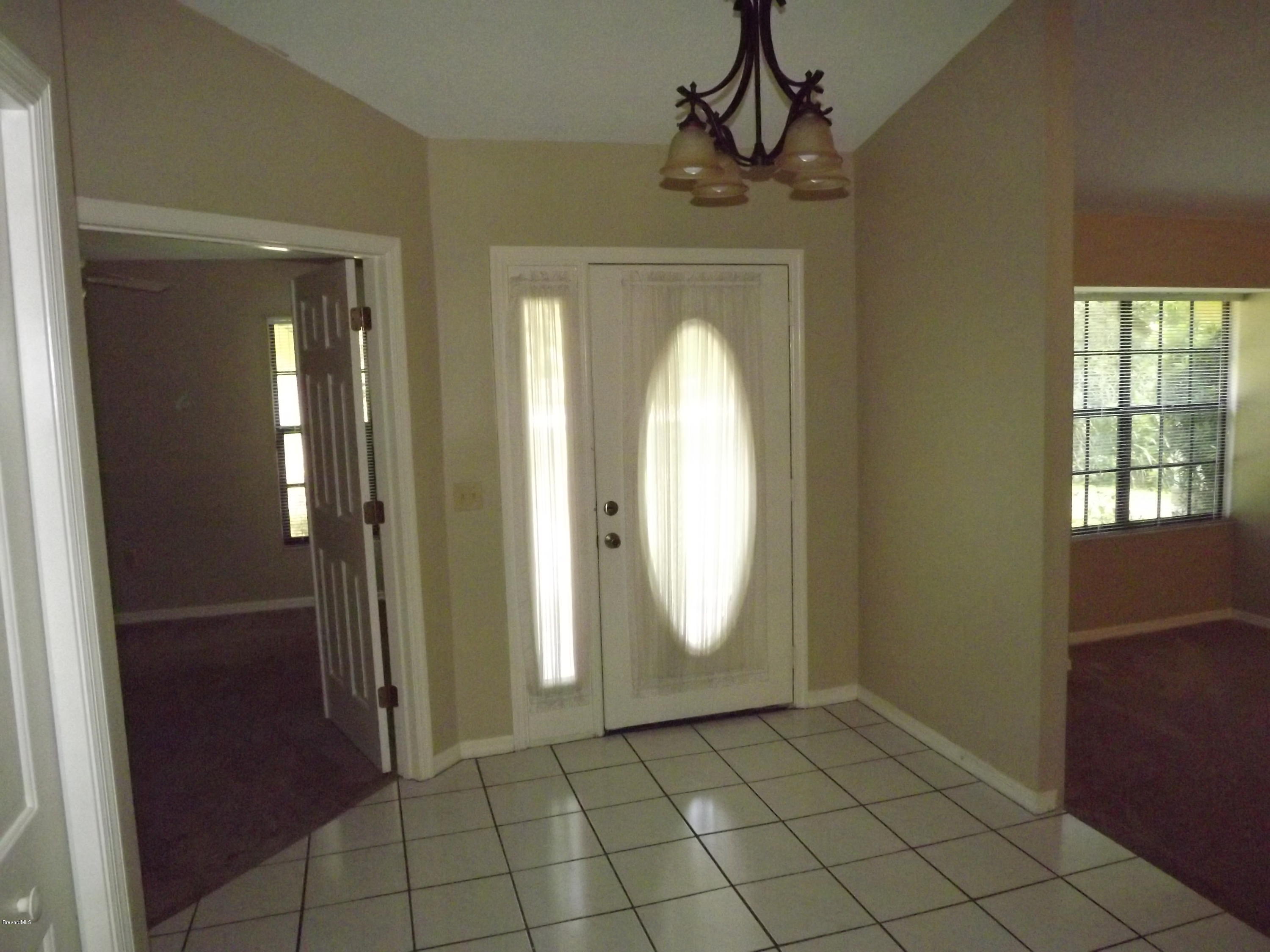2241 Canal Ridge Drive Titusville, FL 32780 - Photo 5 of 39 Front Door and Foyer