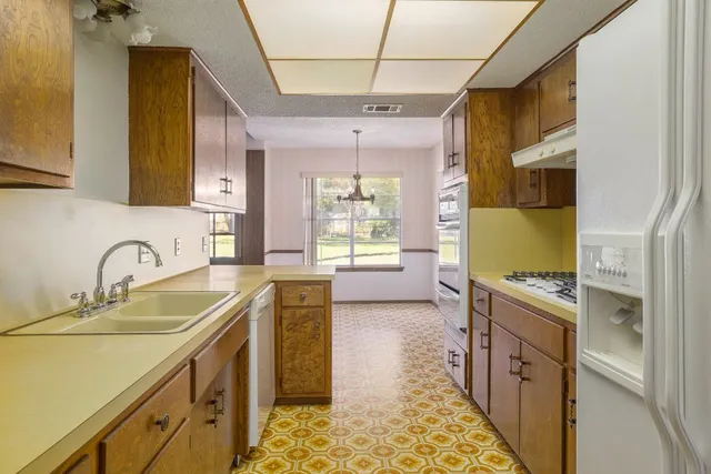 a bathroom with a sink a vanity and a mirror