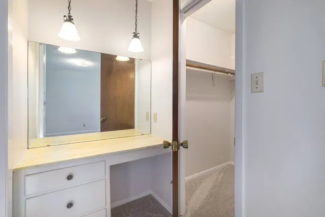 a bathroom with a sink and mirror